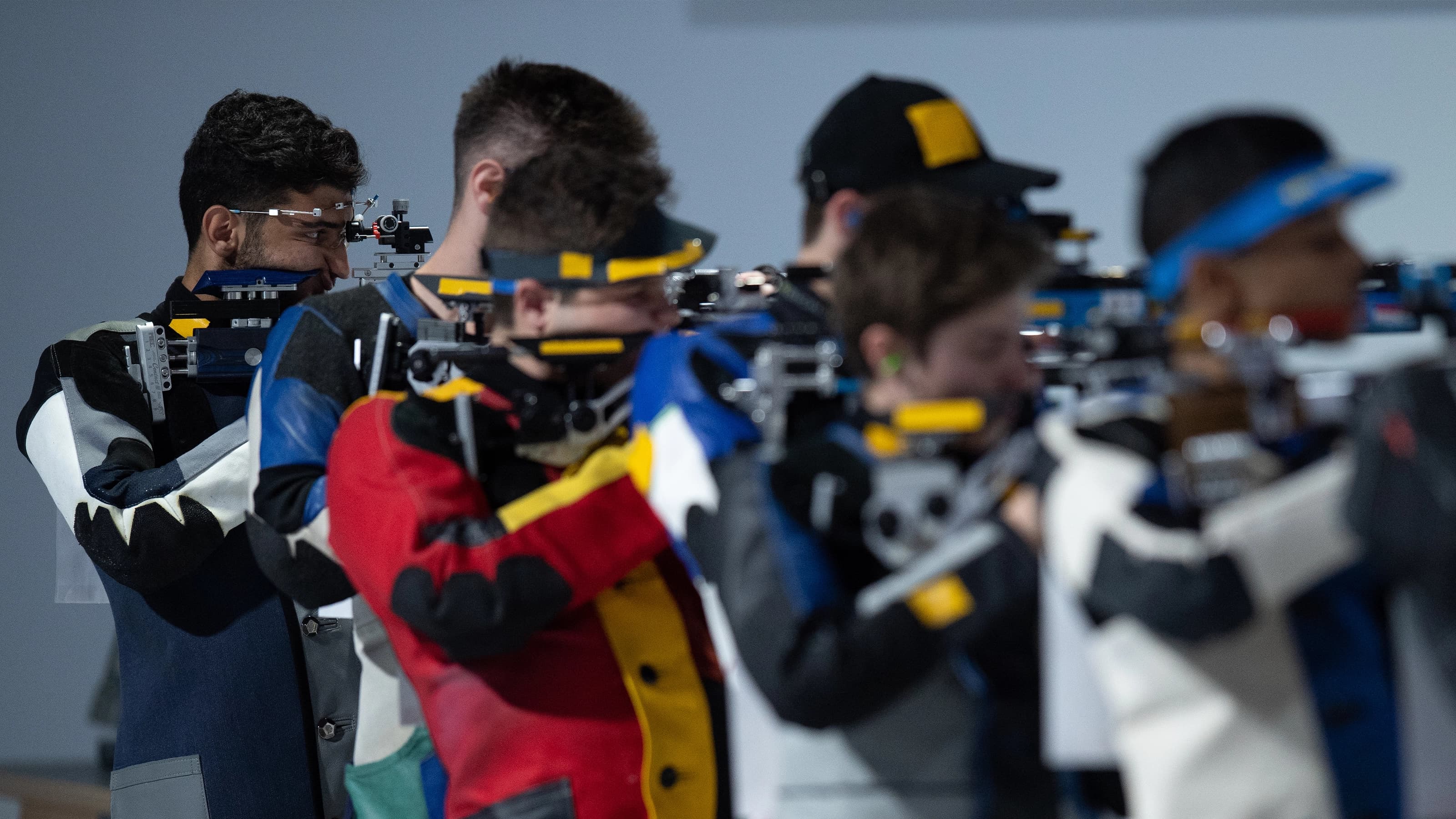 Shooters standing in a row competing 