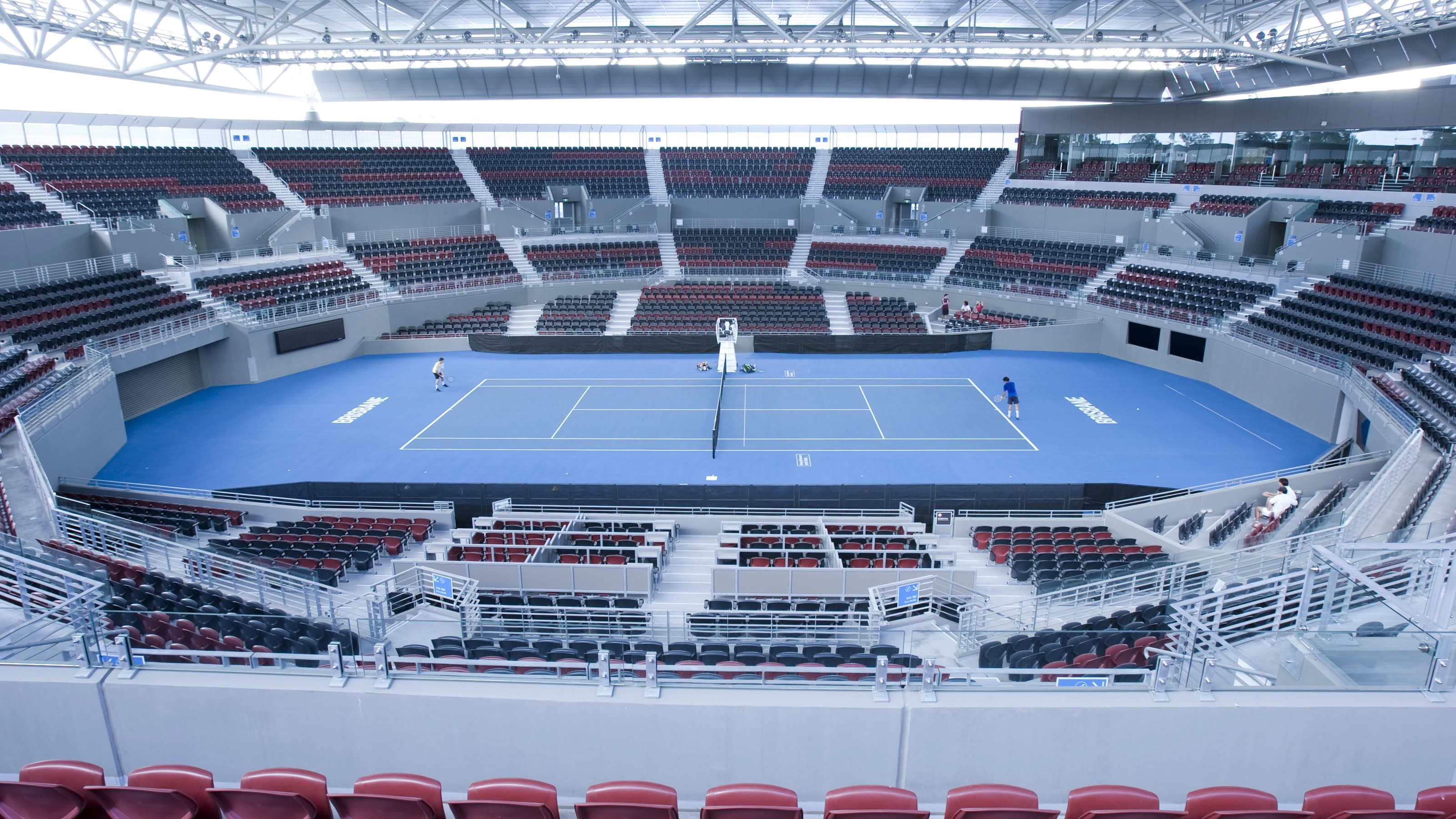 Tennis players on court at Queensland Tennis Centre