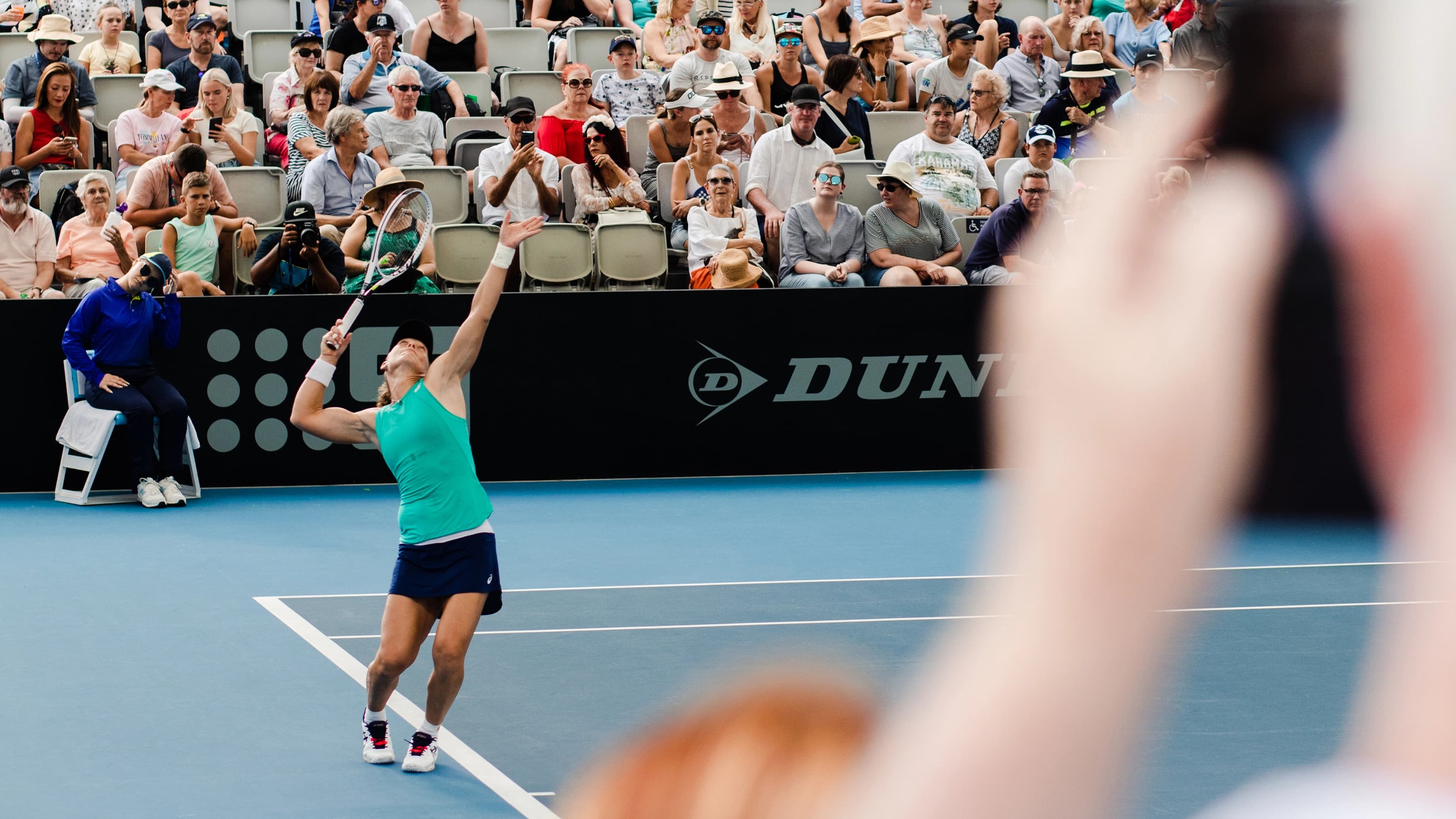 Audience watching a tennis match